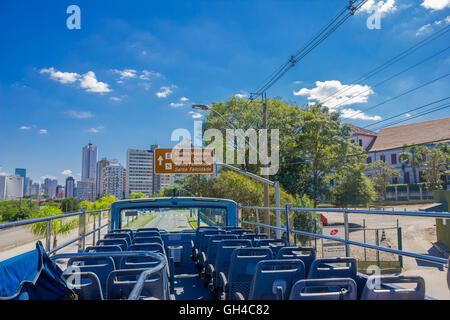 CURITIBA ,BRAZIL - MAY 12, 2016: sign post located at the side of the street indicating the directios to the city center Stock Photo