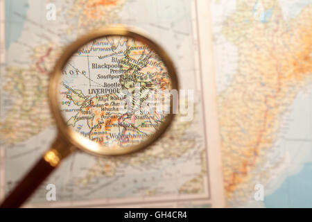 Magnifying glass in front of a Liverpool map Stock Photo