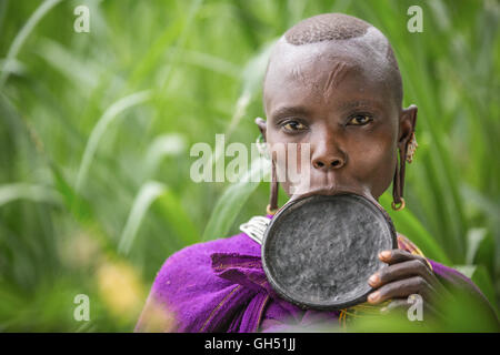 Young girl from Suri tribe with traditional lip plate Stock Photo