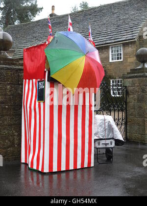 A rained-off Punch and Judy stall at Ashover May Day Carnival, near Chesterfield, Derbyshire Stock Photo