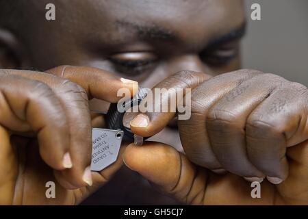 geography / travel, Sierra Leone, diamond merchant seeing yourself through of a magnifying glass of a diamond at, Koidu, Kono district, Eastern Province, Additional-Rights-Clearance-Info-Not-Available Stock Photo