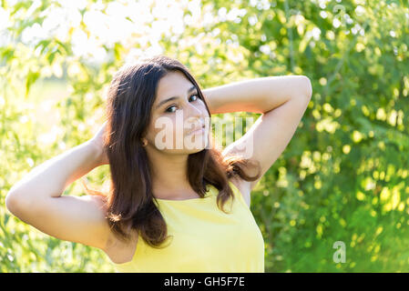 Portrait of 14 year old girl outdoors on a sunny day Stock Photo