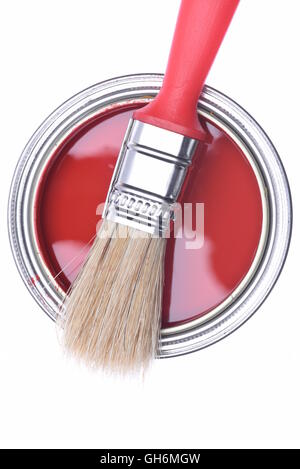 Top view of red paint can with brush isolated on white background Stock Photo