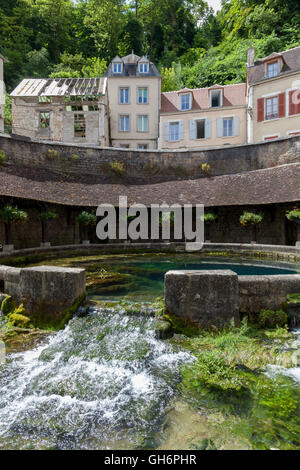 La Fosse Dionne  is a karst spring located in downtown Tonnerre. France. Stock Photo