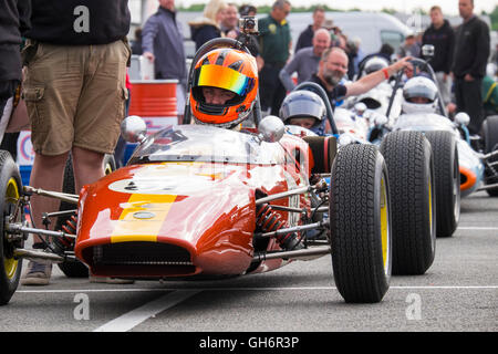 Formula Junior racing cars lined up in the paddock at the 2016 Silverstone Classic event, England, UK Stock Photo