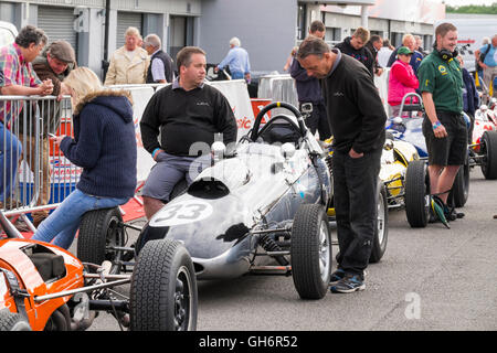 Formula Junior racing cars lined up in the paddock, 2016 Silverstone Classic event, England, UK Stock Photo