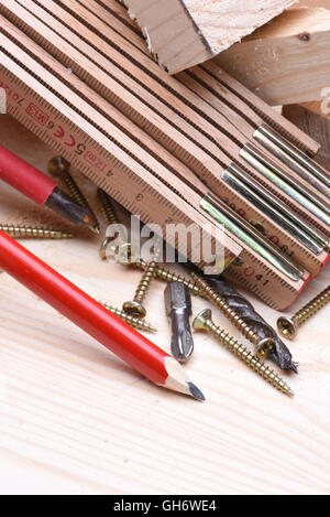 Carpentry tools with wooden bricks on work table close up Stock Photo