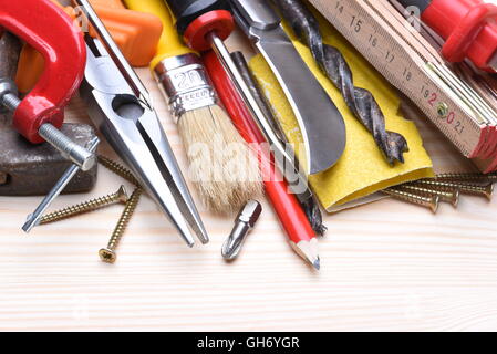 Set of working tools on wooden board Stock Photo