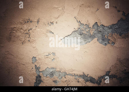 Dark yellow weathered concrete wall, background photo texture with spot light illumination Stock Photo