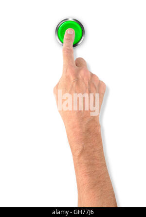 A man pushing a big green start stop alarm button with the finger Stock Photo