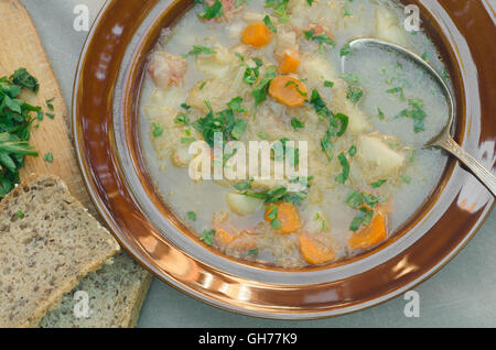 cabbage soup in plate on table Stock Photo