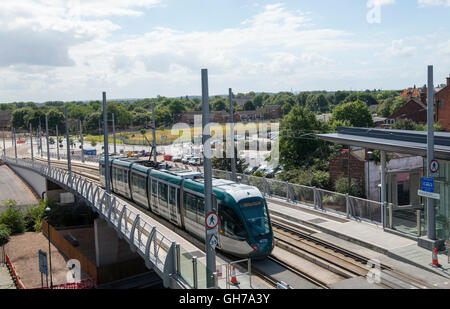 Tram coming into the stop at Nottingham Train Station in Nottingham City, Nottinghamshire England UK Stock Photo