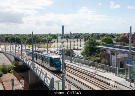 Tram coming into the stop at Nottingham Train Station in Nottingham City, Nottinghamshire England UK Stock Photo