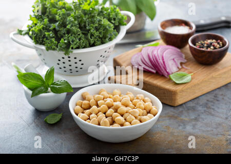 Cooking with kale and chickpeas Stock Photo