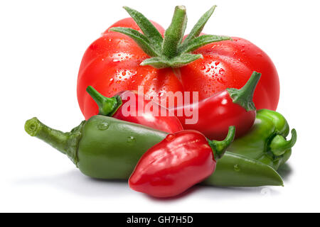 Heirloom tomato, red and green habanero peppers, chil. Ingredients for hot sauce, ketchup, tabasco. Clipping paths, shadow separ Stock Photo