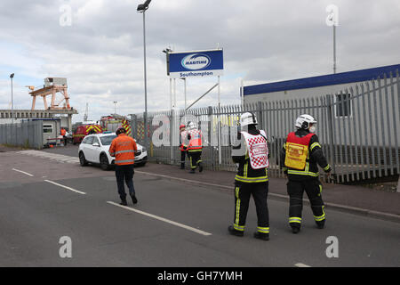 Marchwood, Hamphire, UK. 8th August 2016. Emergency crews from Hampshire fire and rescue service and South central  ambulance  service remain at the  cene of a  fire that broke out just after lunchtime today.  Fire crews have been brought from a far a field as Portsmouth to tackle the blaze at the fire at the recycling centre in East Road  Marchwood.  Eight fire engines two aerial ladders  and the incident command unit from Eastleigh been brought in to put out the fire out. Credit:  uknip/Alamy Live News Stock Photo