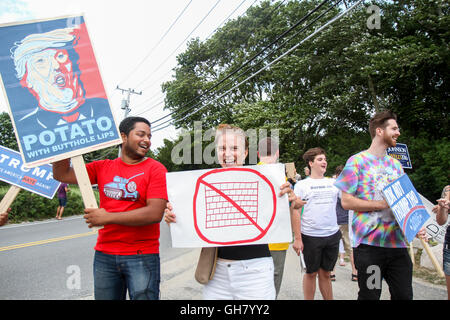 Osterville, Massachusetts, USA. 6th August, 2016. Protesters hold signs at a rally opposing Republican presidential nominee Donald Trump, near a fundraiser businessman William Koch is hosting for Trump. Credit:  Susan Pease/Alamy Live News Stock Photo