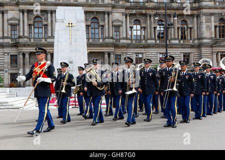Glasgow, UK. 9th August, 2016. On the second day of 'Piping Life' the bands from The Royal Edinburgh Military Tattoo parade around George Square before entering the Piping Live arena for a spectacular display. The image is of USA Army Band and Chorus marching in George Square in front of the Cenotaph and City Chambers. Credit:  Findlay/Alamy Live News Stock Photo