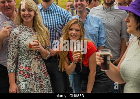 London, UK. 9th August, 2016. Women enjoying pints - The Great British Beer Festival organised by the Campaign for Real Ale (CAMRA) offers visitors over 900 real ales, ciders, perries and international beers at Olympia. Credit:  Guy Bell/Alamy Live News Stock Photo