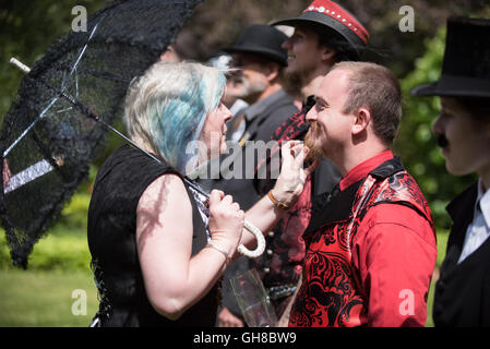 Woman checking a beard at the facial hair competition of papplewick pumping stations steam punk event Stock Photo