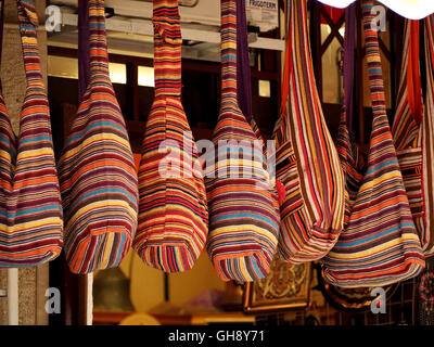 colourful colorful woven stripy bags hanging on display for sale in Mostar Bosnia & Herzegovina Stock Photo