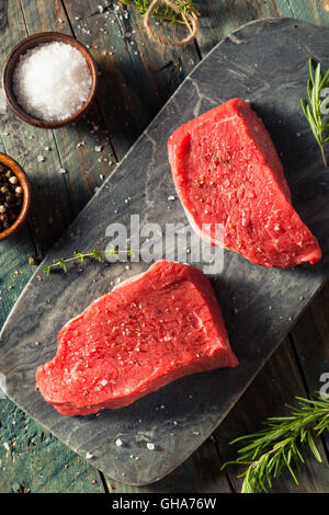 Raw Organic Grass Fed Sirloin Steak with Salt and Pepper Stock Photo