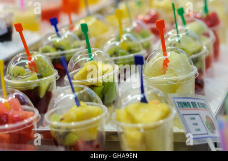on the market freshly squeezed fruit juices Stock Photo