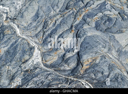 A closeup of a boulder.  The rock makes beautiful patterns. Stock Photo