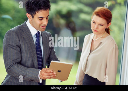 Two business people discussing work Stock Photo