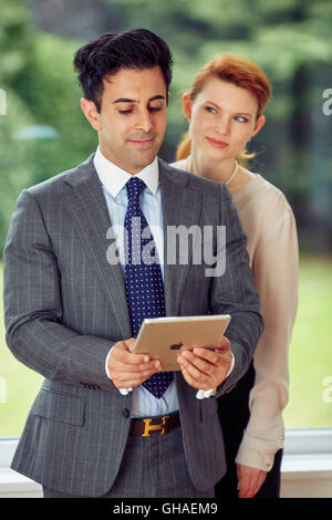 Two business people discussing work Stock Photo