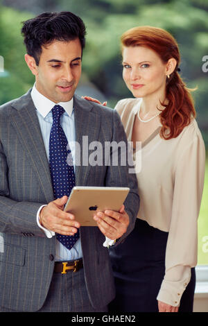 Two business people discussing work Stock Photo