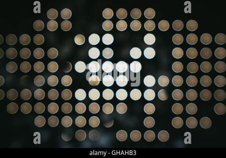 Dark abstract background of bokeh in grid pattern Stock Photo