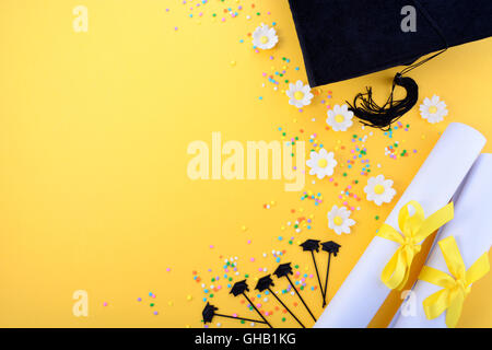 Yellow black and white theme graduation background with decorated borders on yellow background. Stock Photo