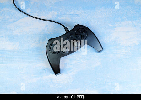 Game pad controller on wooden desk, flat lay top view, gaming and entertainment concept with copy space Stock Photo