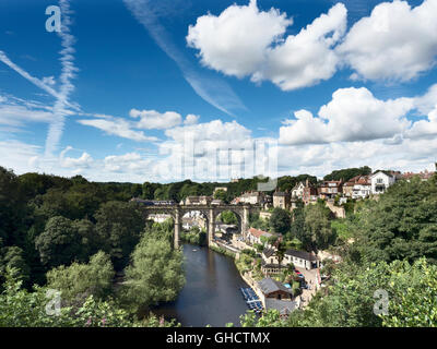 White Clouds in a Blue Sky above the Railway Viaduct over the Nidd Gorge at Knaresborough in Summer North Yorkshire England Stock Photo