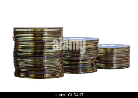 Studio shot of isolated descending stacks of old grungy compact disks on white background Stock Photo