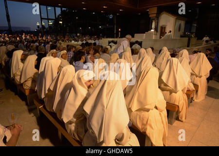 Portugal, Sanctuary of Fatima, nuns following the night open-air mass in the Chapel of the Apparitions (Capelinha das Aparições) Stock Photo