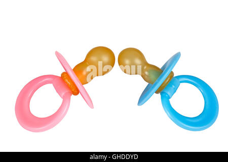 Isolated pair of blue and pink baby pacifier dummies in on white background Stock Photo