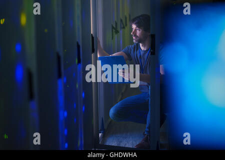 Server room technician with clipboard Stock Photo