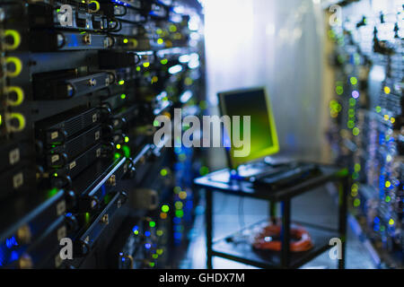Computer on cart in server room corridor Stock Photo