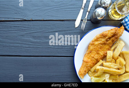 Deep fried fish and chips on a wooden table with space Stock Photo