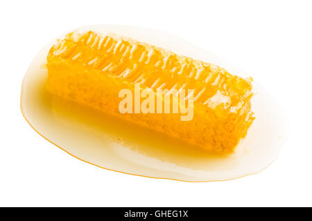Fresh honey with honeycomb isolated on white background. Stock Photo