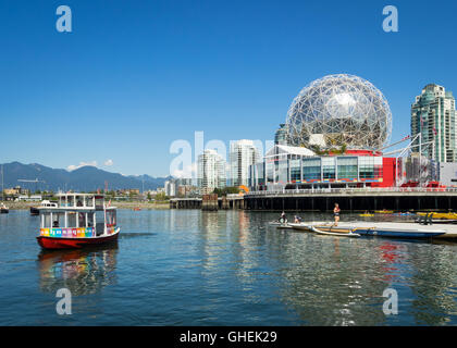 A view of an Aquabus and Science World at Telus World of Science on False Creek in Vancouver, British Columbia, Canada. Stock Photo