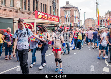 Guys waring dogs face masks at Leeds Gay Pride 2016, LGBT 10th anniversary a celebration of life,love,colour,tolerance,freedom and understanding. Stock Photo