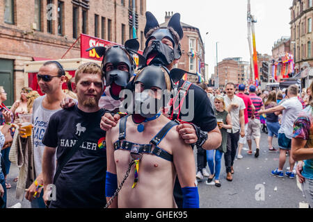 Guys waring dogs face masks at Leeds Gay Pride 2016, LGBT 10th anniversary a celebration of life,love,colour,tolerance,freedom and understanding. Stock Photo