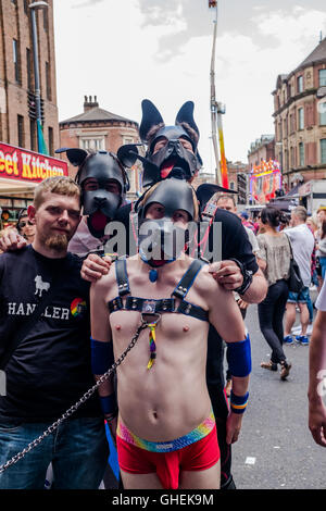 Guys waring dogs face masks at Leeds Gay Pride 2016, LGBT 10th anniversary a celebration of life,love,colour,tolerance,freedom and understanding. Stock Photo