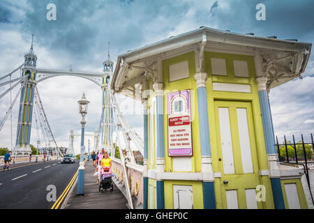 A colourful lime green tollbooth on the Albert Bridge, Chelsea, London, England, UK Stock Photo