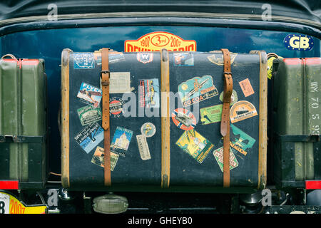 Old traveling trunk on a vintage car. UK. Vintage filter applied Stock Photo