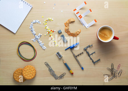 Office life inscription on a wooden desk laid out of stationery. Clerk's weekdays. Daily routine. Stock Photo