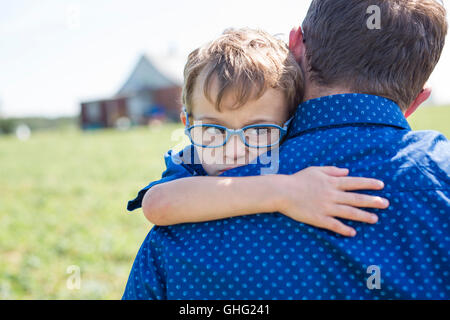 Father And Son Hugging On Outdoor summer Stock Photo